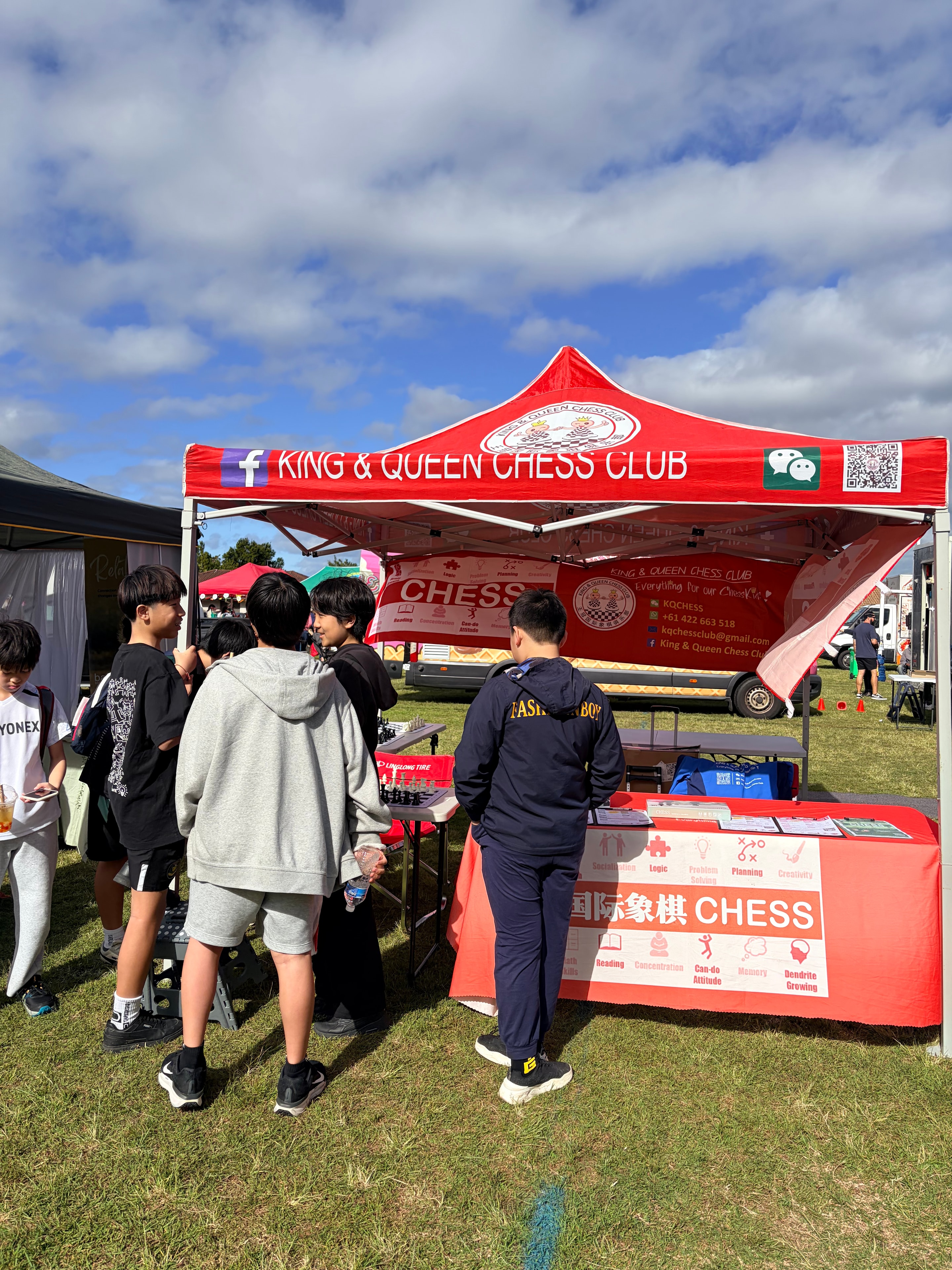 Students visiting the King & Queen Chess Club booth