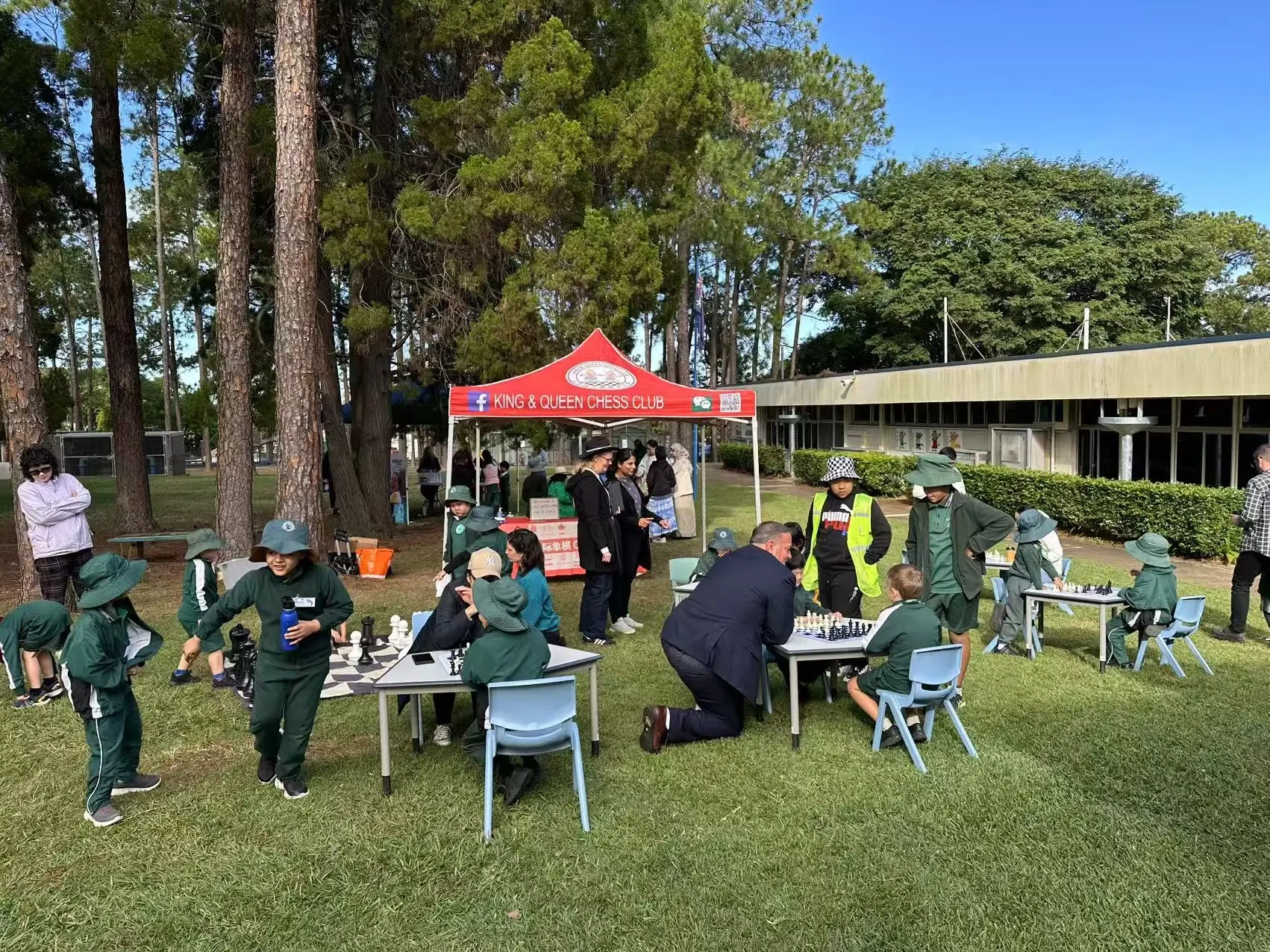 Children enjoying friendly chess games at a school event