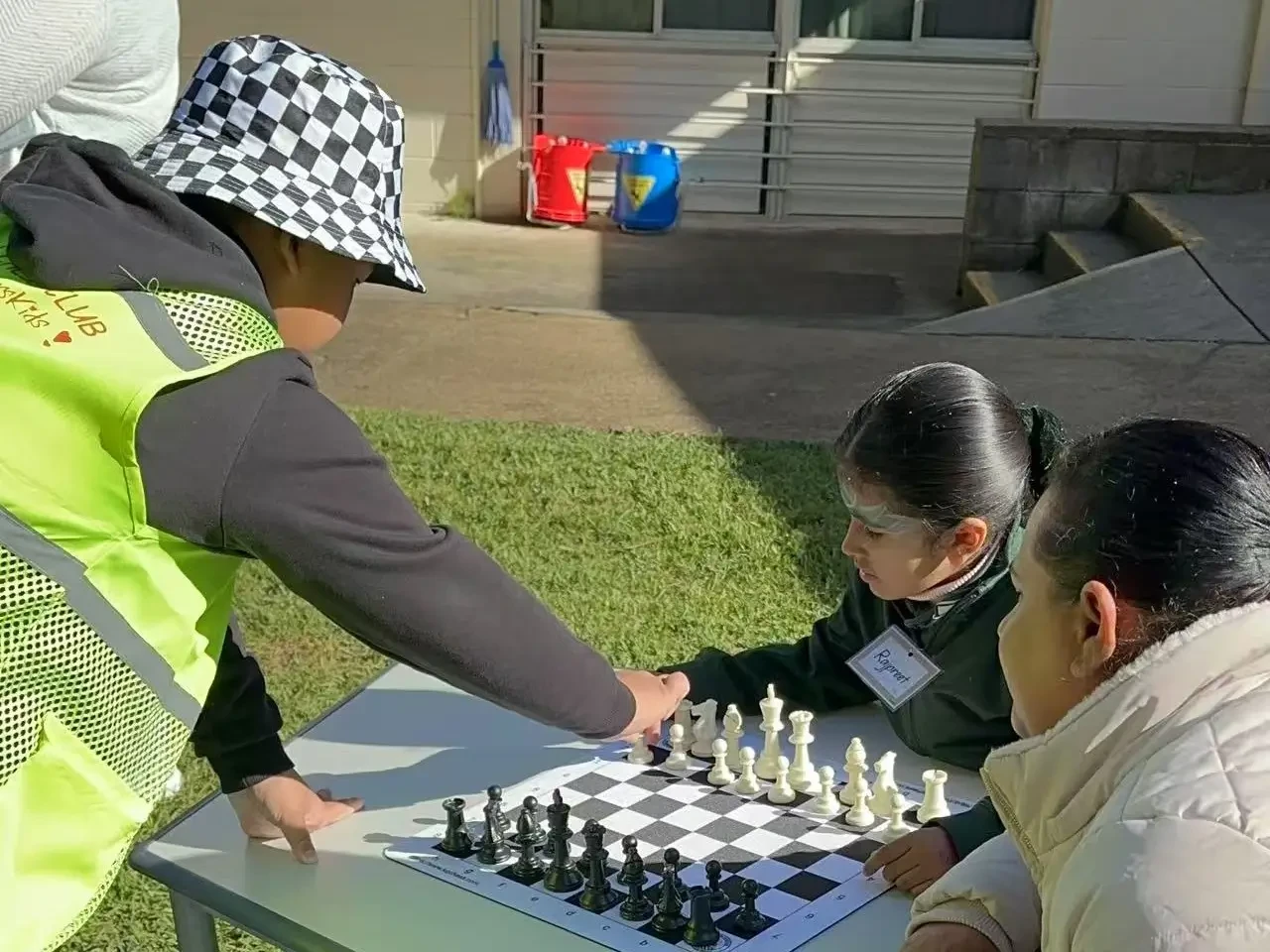 Students visiting the chess booth